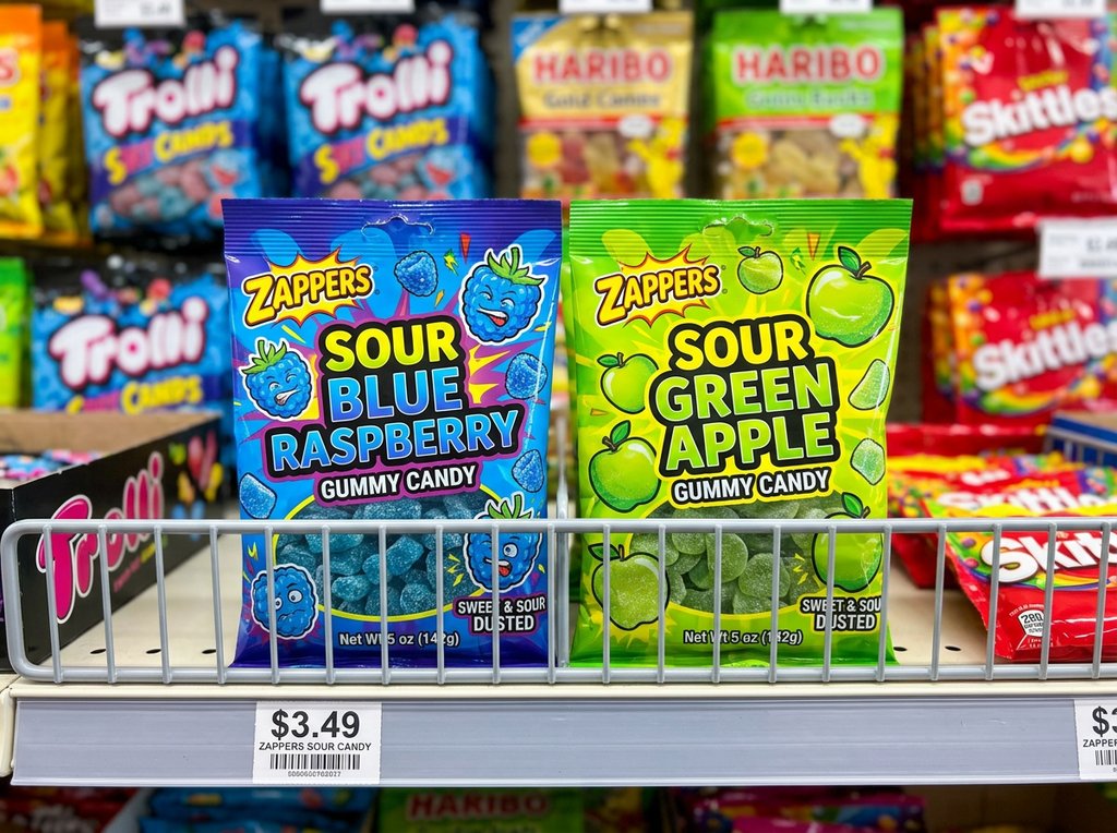 karl gummies — variety display showing sour blue raspberry and sour green apple flavor bags side by side